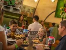 Guests eating at End Zone Food Court, Disney's All-Star Sports Resort
