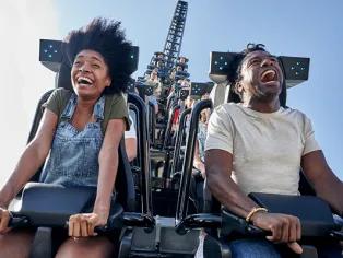 Guests riding Jurassic World VelociCoaster at Universal Islands of Adventure