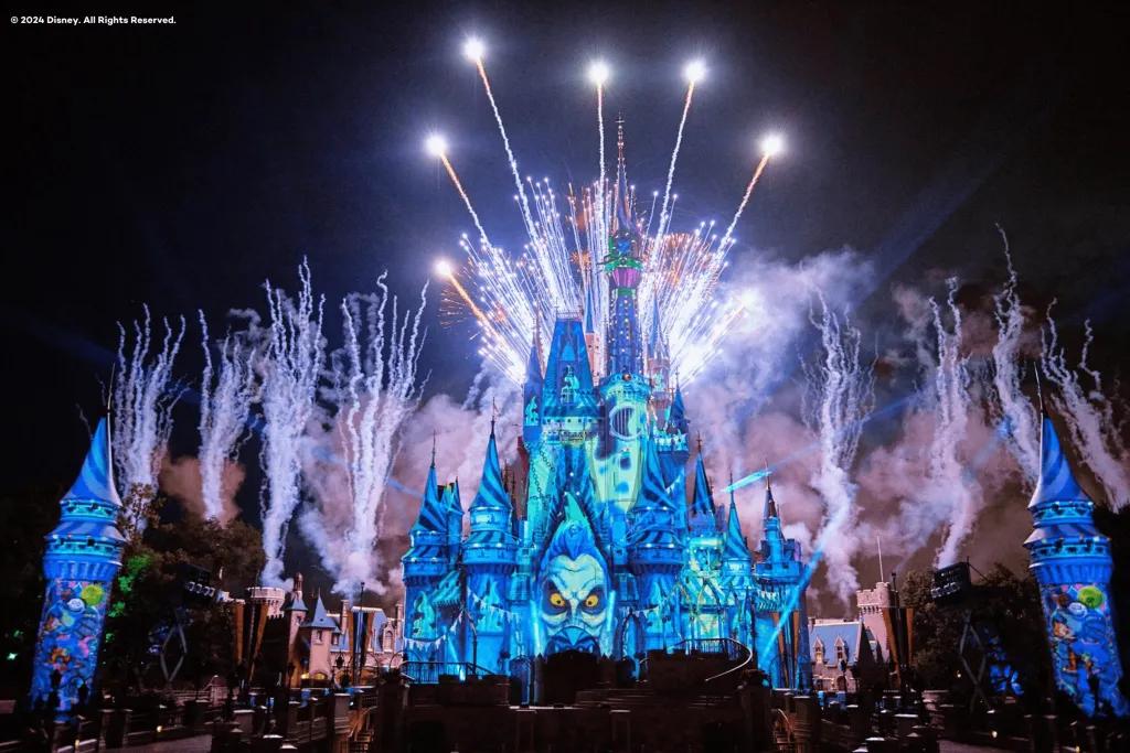 Cinderella Castle with a projection of Hades from Hercules and fireworks above