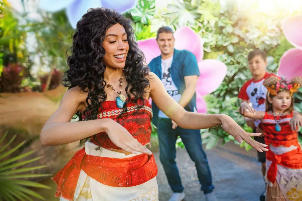 Moana dancing with guests of all ages.