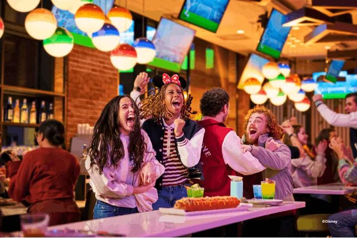 Guests at the Sports Bar & Lounge at Disney Village