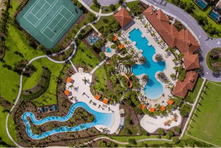 Aerial view of the water park, lazy river, and tennis courts at Solterra Resort