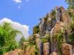 A rock formation with the Heart of Te Fiti at its centre with Spaceship Earth in the background