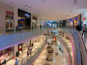 Mall full of rows of different kinds of shops.