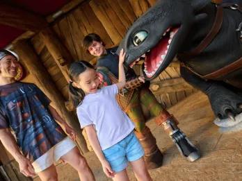 A memorable character encounter with Hiccup and Toothless from How to Train Your Dragon, showcasing a must-do, immersive experience at Universal Orlando Resort.
