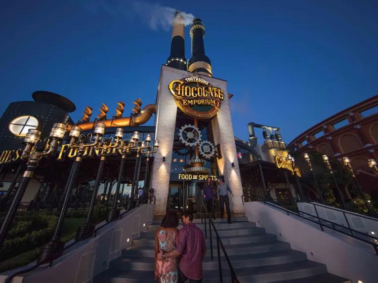 Couple entering the The Toothsome Chocolate Emporium & Savory Feast Kitchen at Universal CityWalk in Orlando