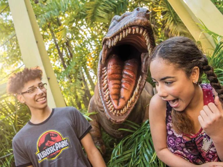 Teens with dinosaur at Universal's Islands of Adventure