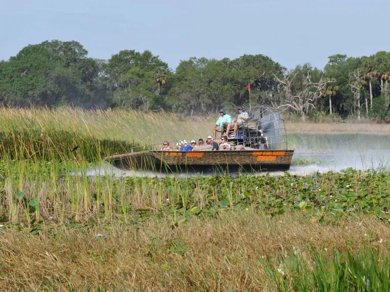 Guests enjoying an airboat ride at Boggy Creek Orlando