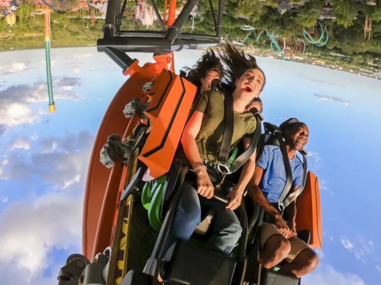 Couple riding inverted Tigris rollercoaster loop at Busch Gardens Tampa Bay