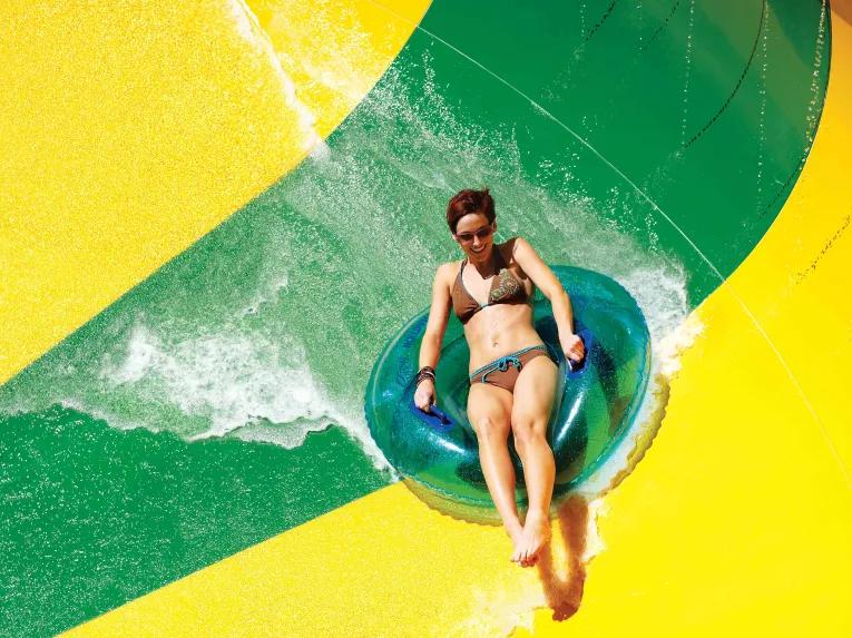 Woman riding Tassie's Twisters at Aquatica Orlando