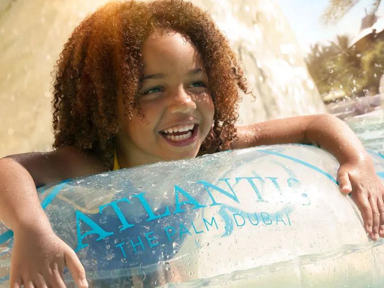 Child floating on the lazy river at Aquaventure Dubai
