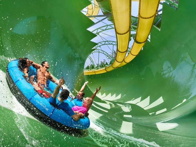 Friends riding Aquaconda water slide at Aquaventure Dubai
