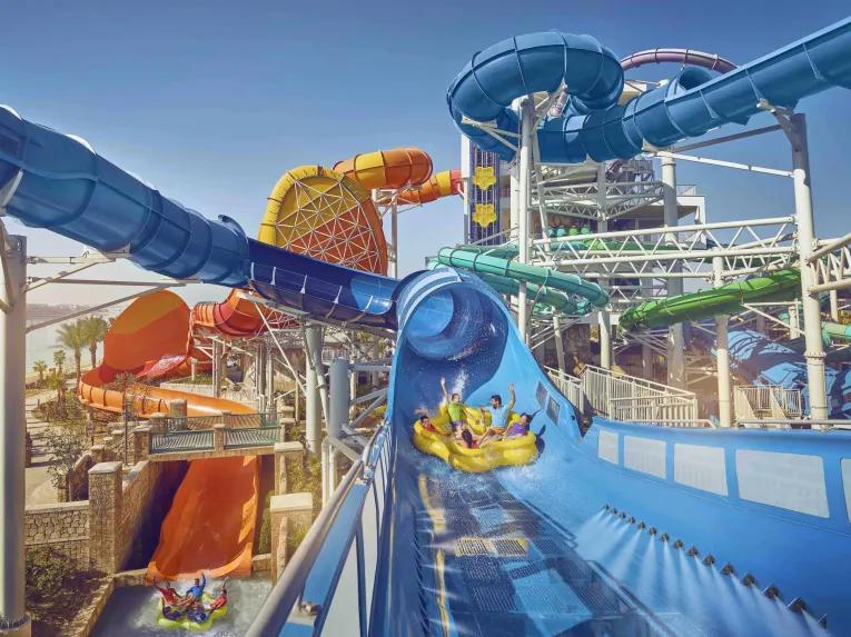 Guests riding Shockwave water coaster at Aquaventure Dubai