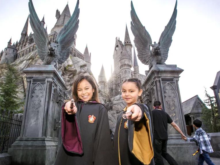 Guests in front of Hogwarts castle at Universal Studios Hollywood