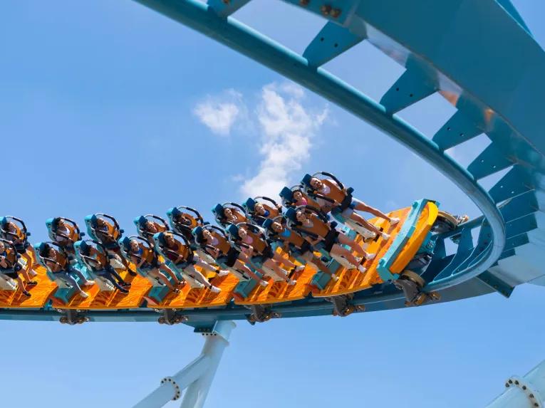 Guests riding Pipeline: The Surf Coaster at SeaWorld Orlando