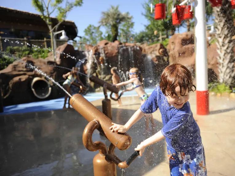 Children at Uwanja Camp water playground, Disney’s Animal Kingdom Lodge
