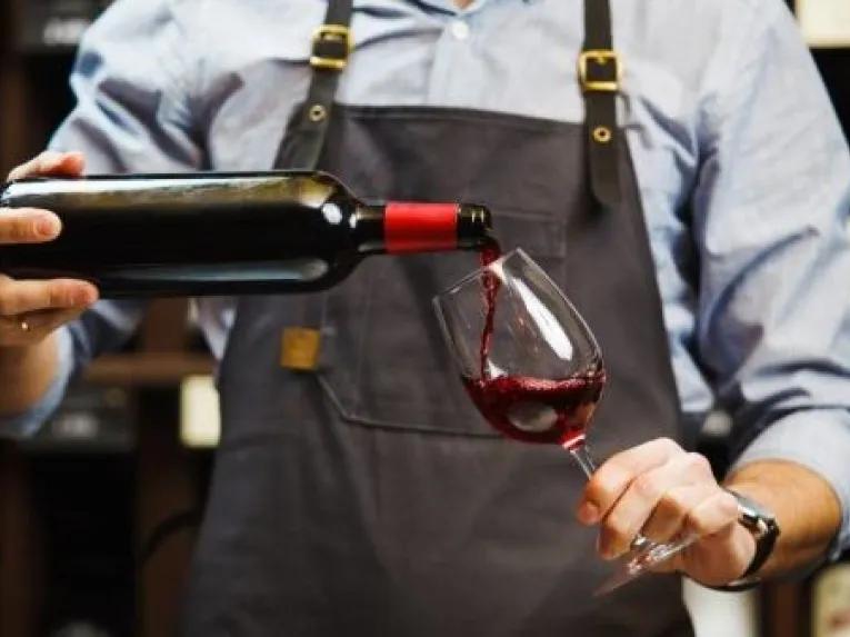 person-pouring-wine