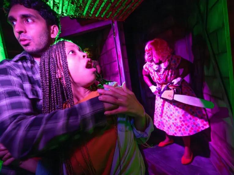 Guests in scare house at Universal Orlando Halloween Horror Nights