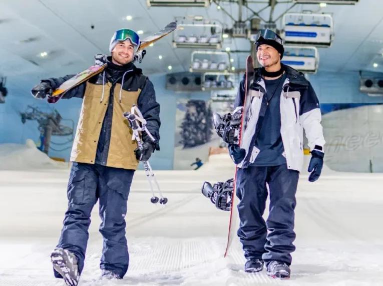 Two friends walking through Ski Dubai after enjoying the indoor ski slopes
