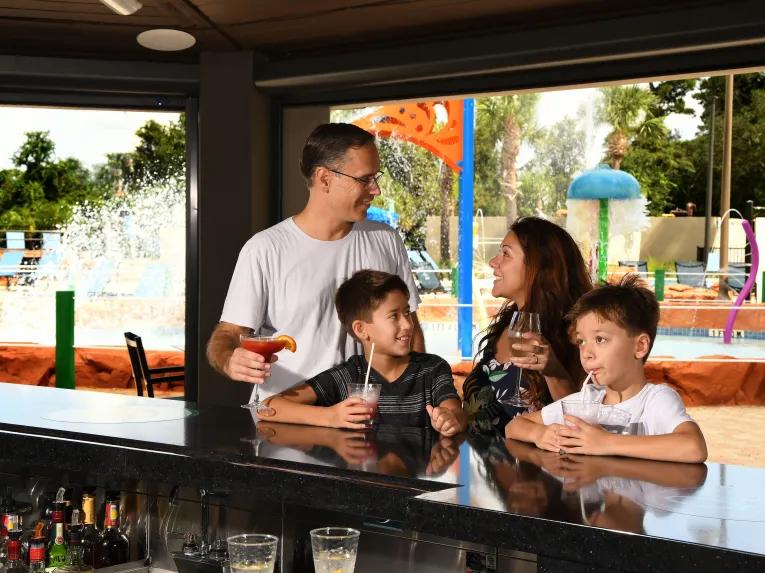 Family at pool bar Wyndham Garden Lake Buena Vista - Disney Springs