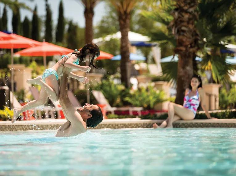 Family in the pool at the Four Seasons Orlando